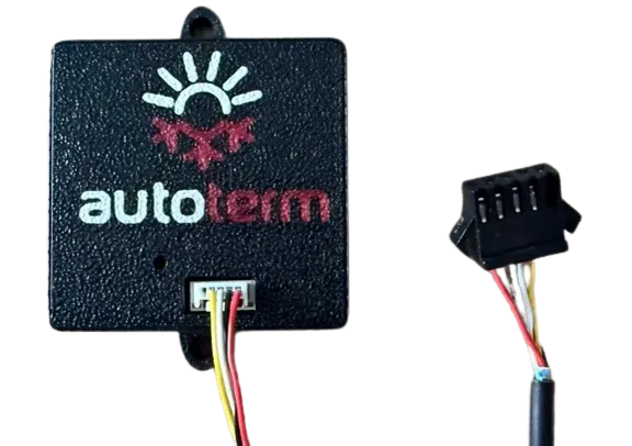 The Autoterm interface module - a small square black case with the autoterm logo on the front, beside the plug and flying lead that join it to the heater