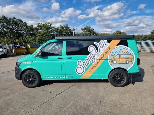 The SavvyVan company van in bright green with new vinyl branding