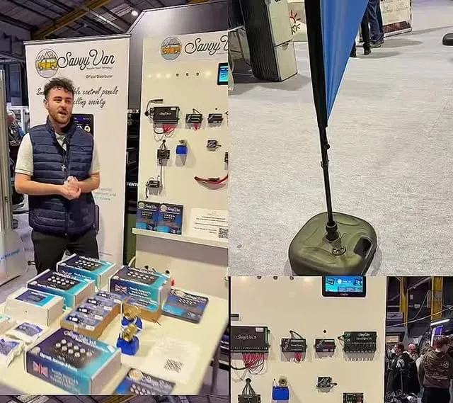 Nathan from Cosy Campers on their stand at the Dublin Holiday Home & Campervan Show, beside SavvyVan panels and modules on display