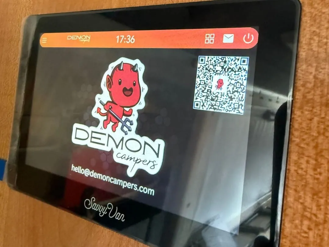 A SavvyVan panel showing Demon Campers’ logo, email address and a QR code
