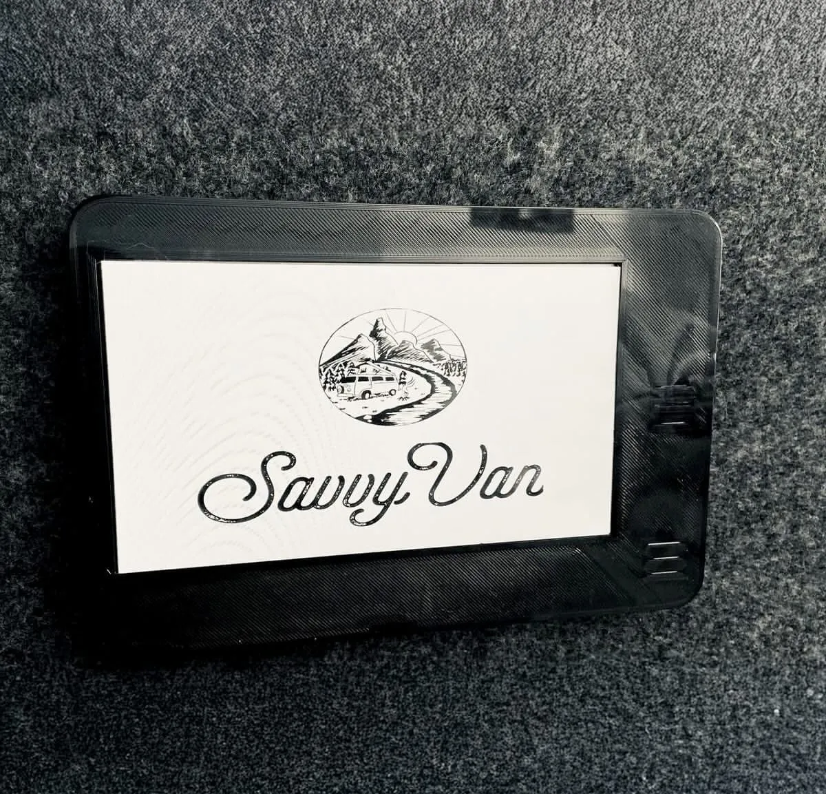 The first SavvyVan prototype: a small black-framed screen showing the SavvyVan logo
