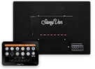SavvyCore from above - a black aluminium box with the SavvyVan fuse panel, eight red blade fuses and a six-way fuse holder - with the 7-inch SavvyVan touch screen in front of it