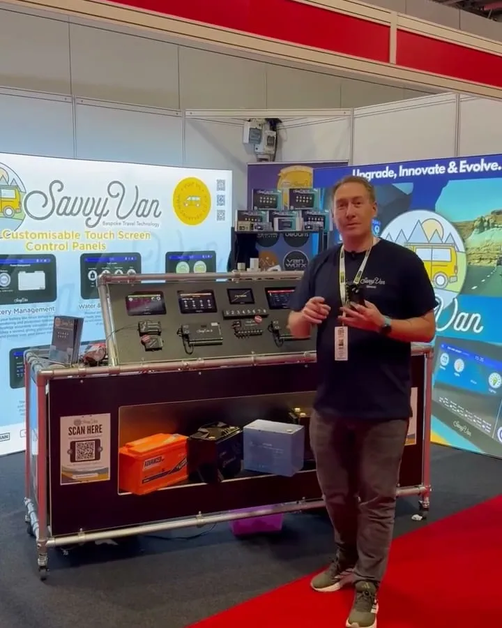 One of the SavvyVan team demonstrating the panel board on stand 12.57 at the NEC