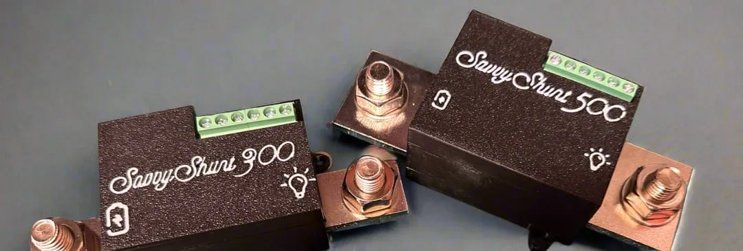 The SavvyShunt 300 and SavvyShunt 500 side by side, each a black module on a metal shunt bar with heavy copper terminals