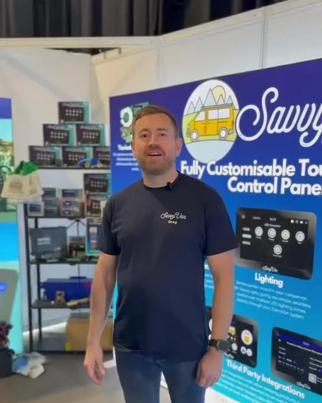 Greg from SavvyVan on the stand at the SEC in Glasgow, in front of a SavvyVan display board