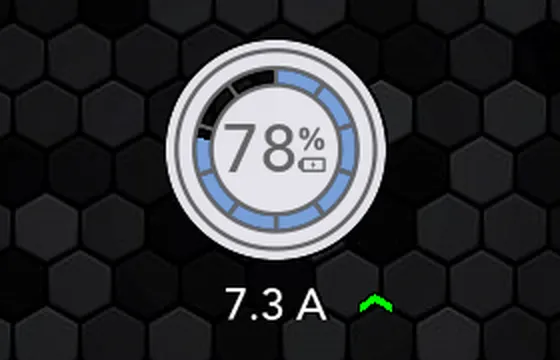 The SavvyVan3 battery indicator from the left of the main screen: a ring filled blue to 78%, with 7.3 A and a green arrow pointing up beneath it