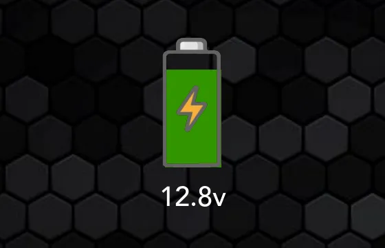 The SavvyVan3 voltage dial: a battery icon filled green, with 12.8v written beneath it