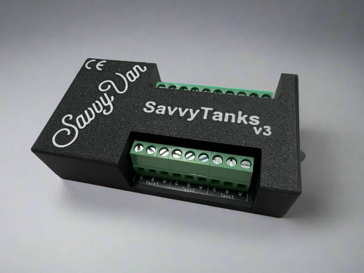 The SavvyTanks V3 module - a small black box with a row of green screw terminals along one edge