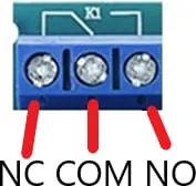 A close-up of a relay’s three screw terminals labelled NC, COM and NO